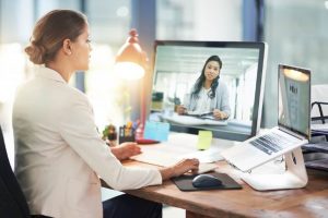 woman talking to woman on a laptop