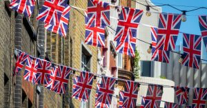 Street party in the UK with Union Jack flags strung between houses